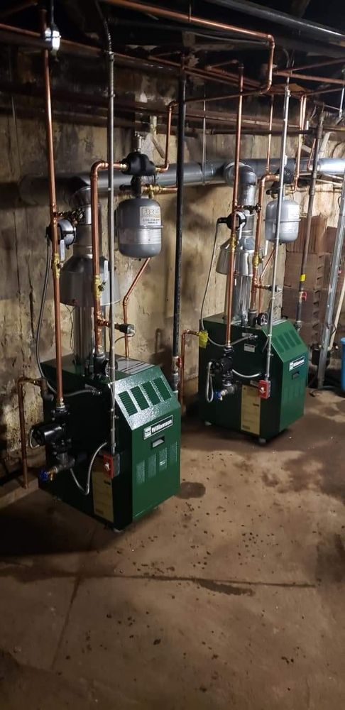 Twin green Williamson boilers with copper piping